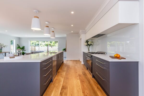 Large designer kitchen in custom design and build house by Frampton Construction