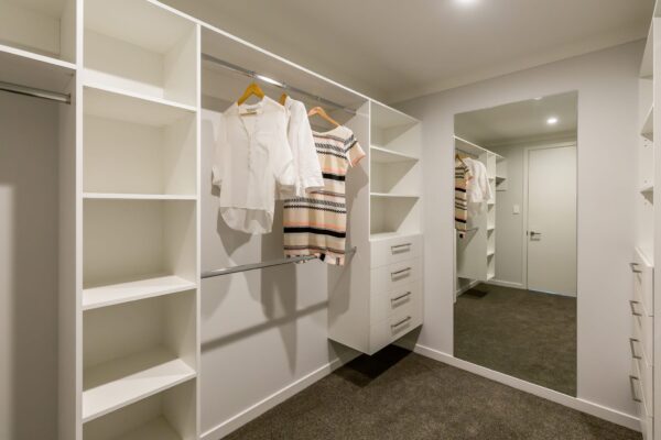 Large walk in wardrobe in new design and build in West Melton by Frampton Construction