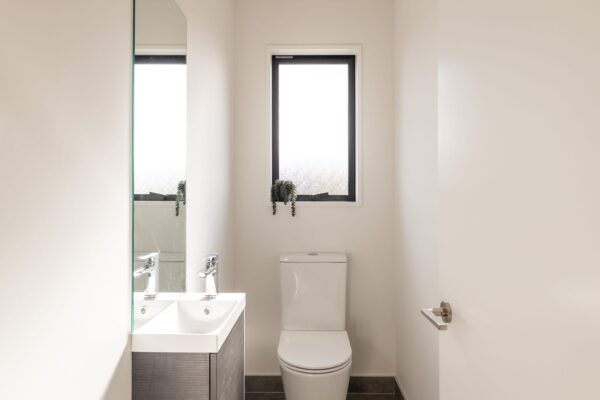 Seperate toilet in home and land package by Frampton Construction Rolleston